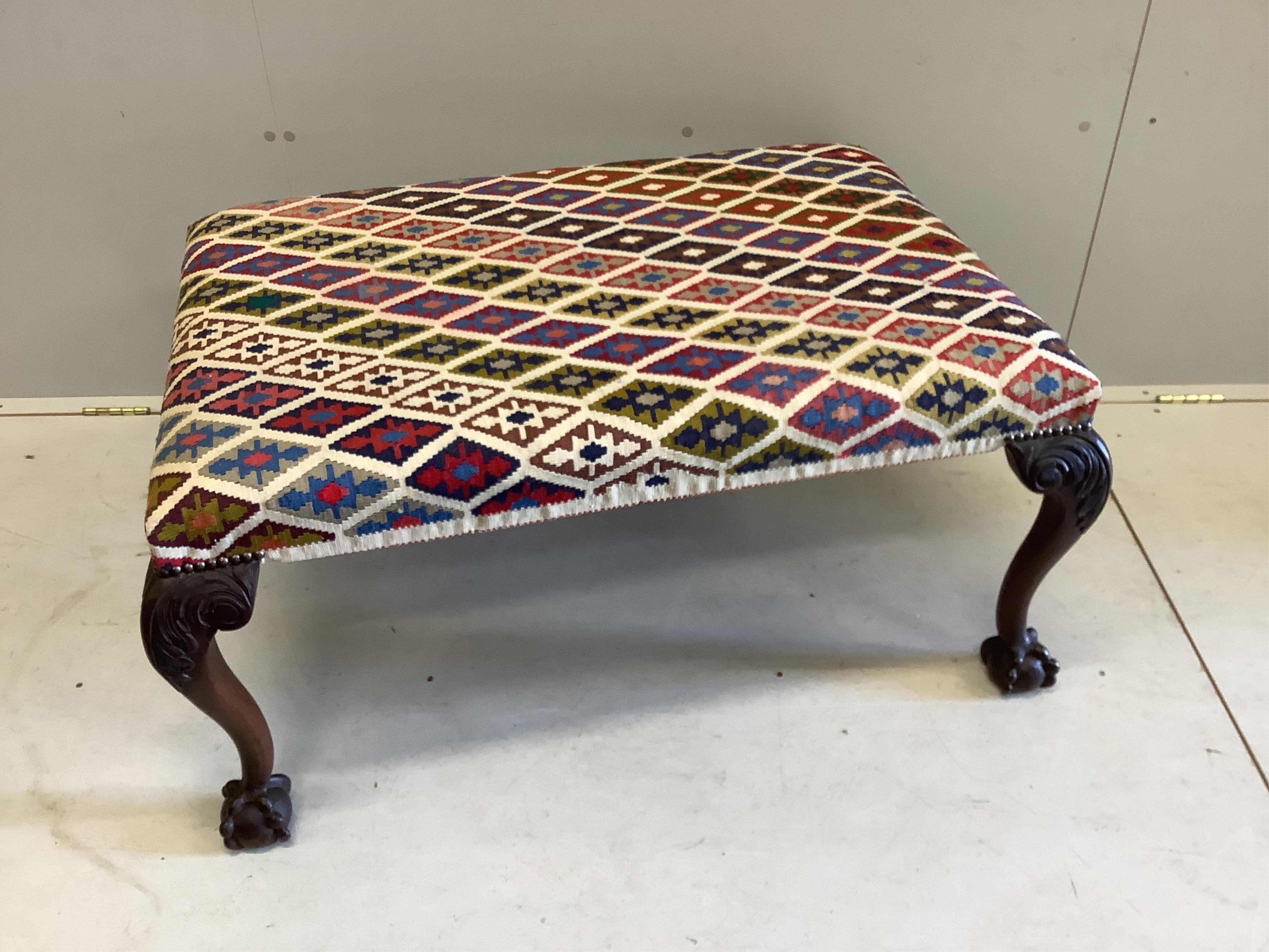 A Chippendale revival mahogany stool with Kelim upholstered seat, width 97cm, depth 67cm, height 47cm. Condition - good